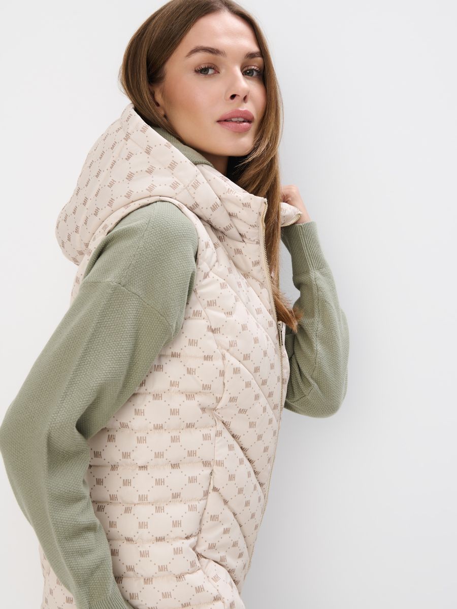 Pikowana kremowa kamizelka z kapturem