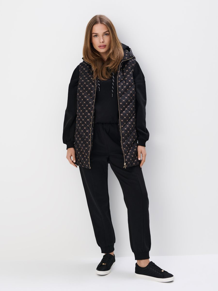 Pikowana kremowa kamizelka z kapturem