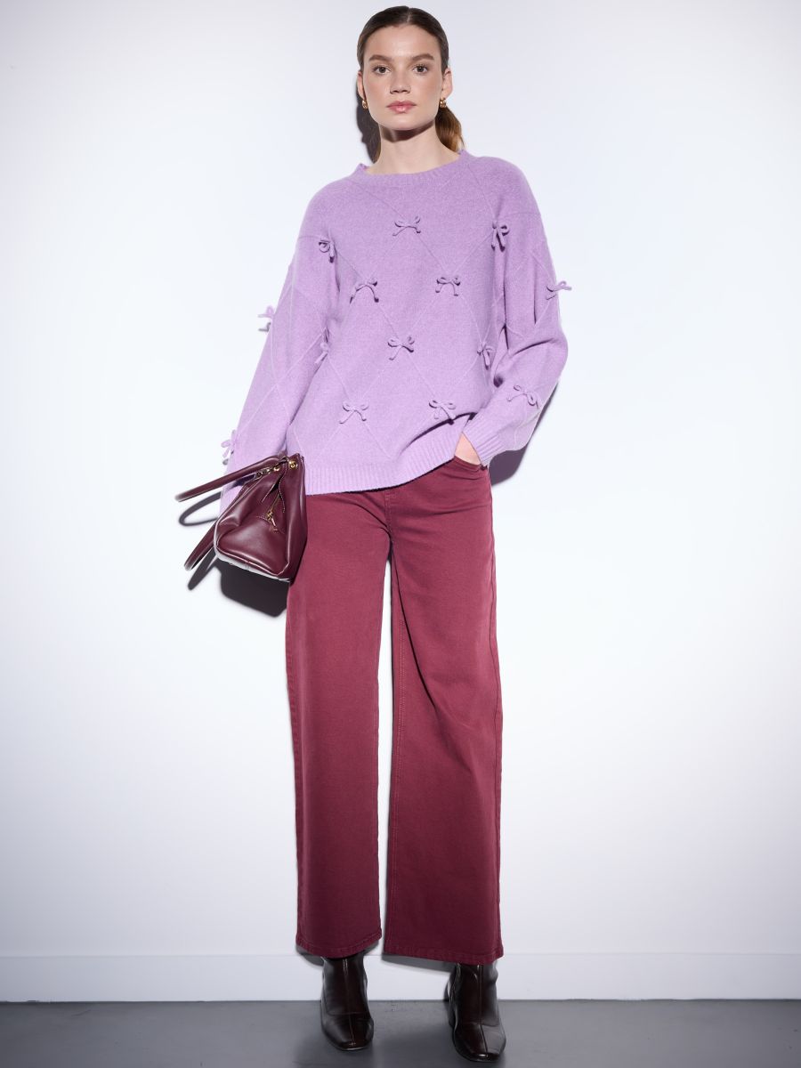 Fioletowy sweter z kokardkami