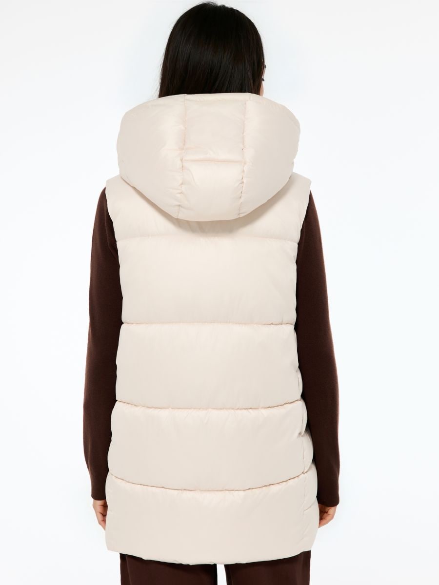 Pikowana kremowa kamizelka