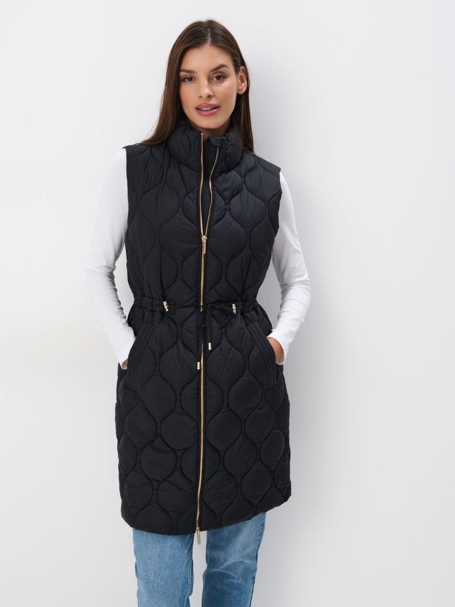 Pikowana beżowa kamizelka