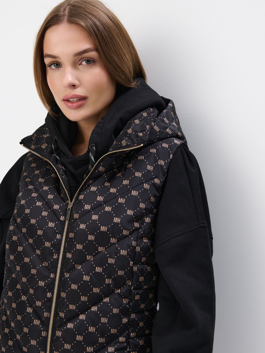 Pikowana kremowa kamizelka z kapturem