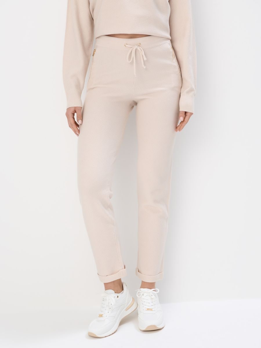 Dzianinowe kremowe spodnie