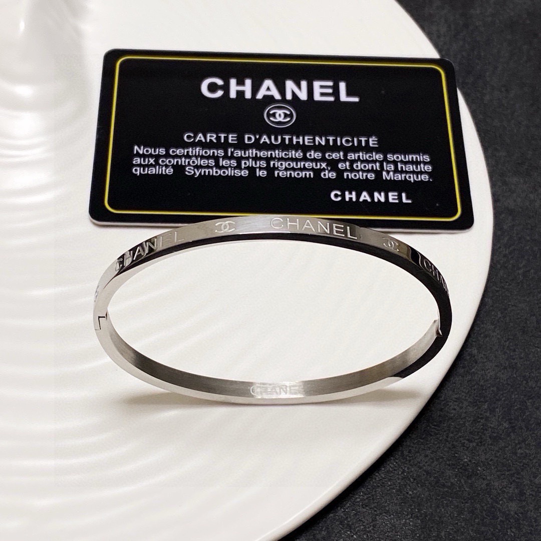 Chanel Silver-Tone Engraved Logo Hinged Bangle