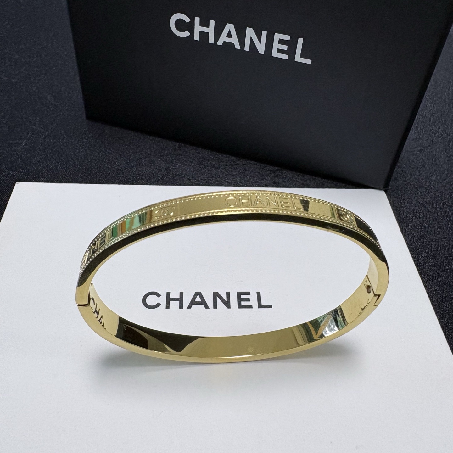 Chanel Gold-Tone Logo Bangle with Beaded Edge