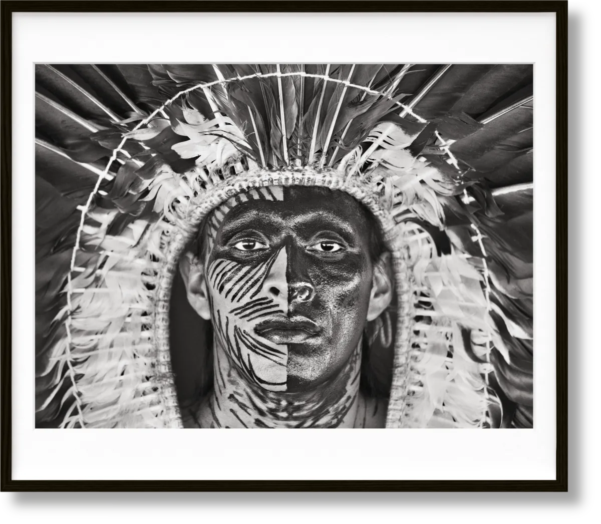 Sebastião Salgado. Amazônia, Art Edition No. 1–100 ‘Adão Yawanawá in a headdress of eagle feathers’