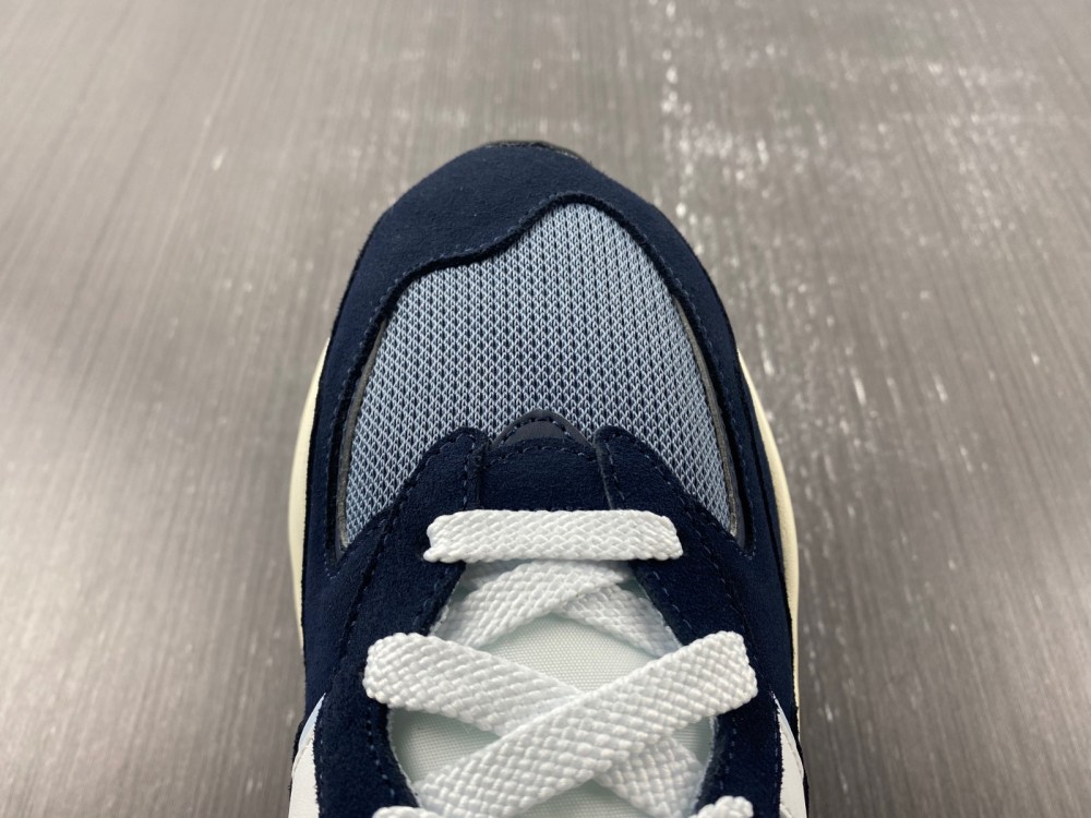 New Balance navy and white trainer
