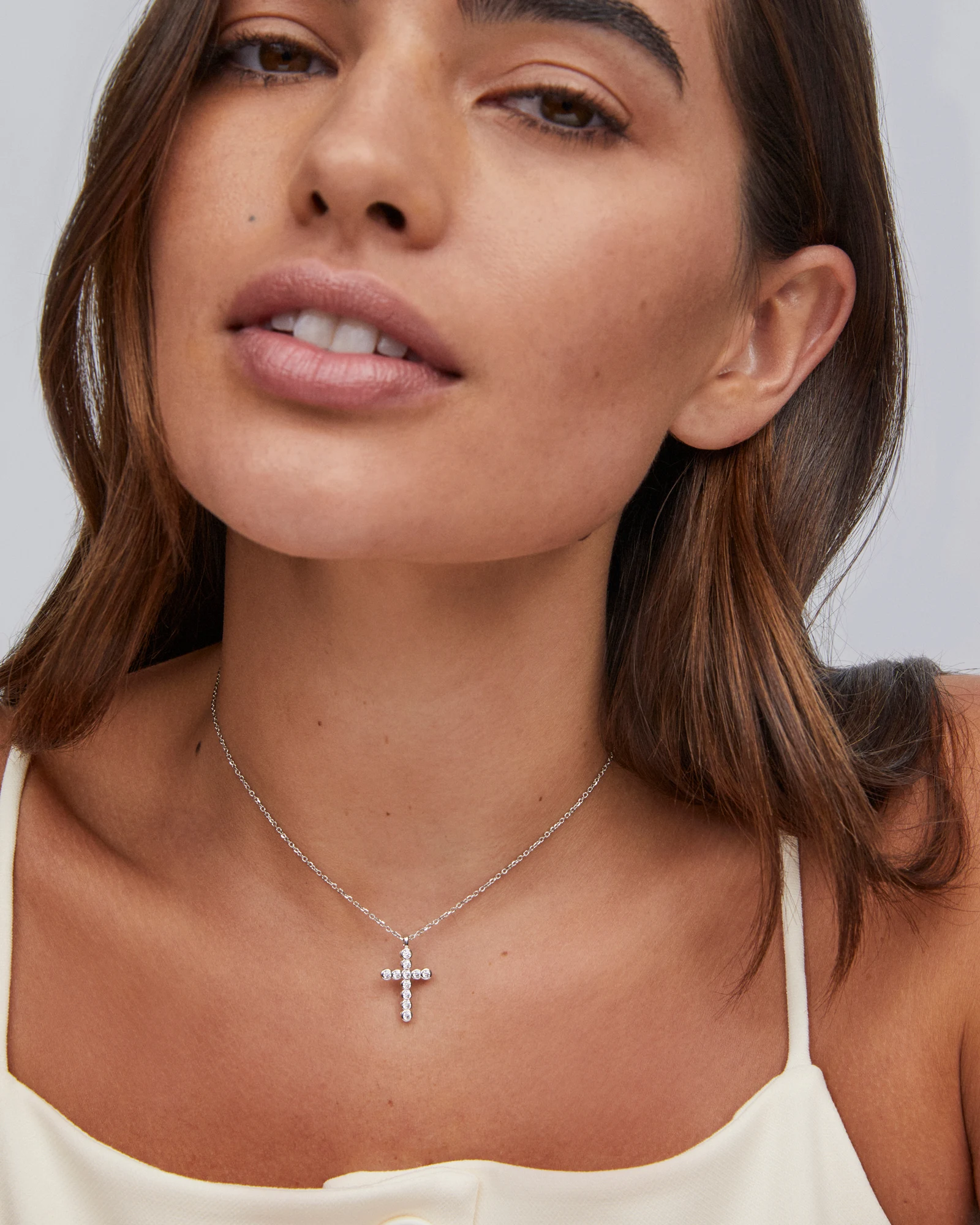 Cross Gold Pendant Necklace in White CZ