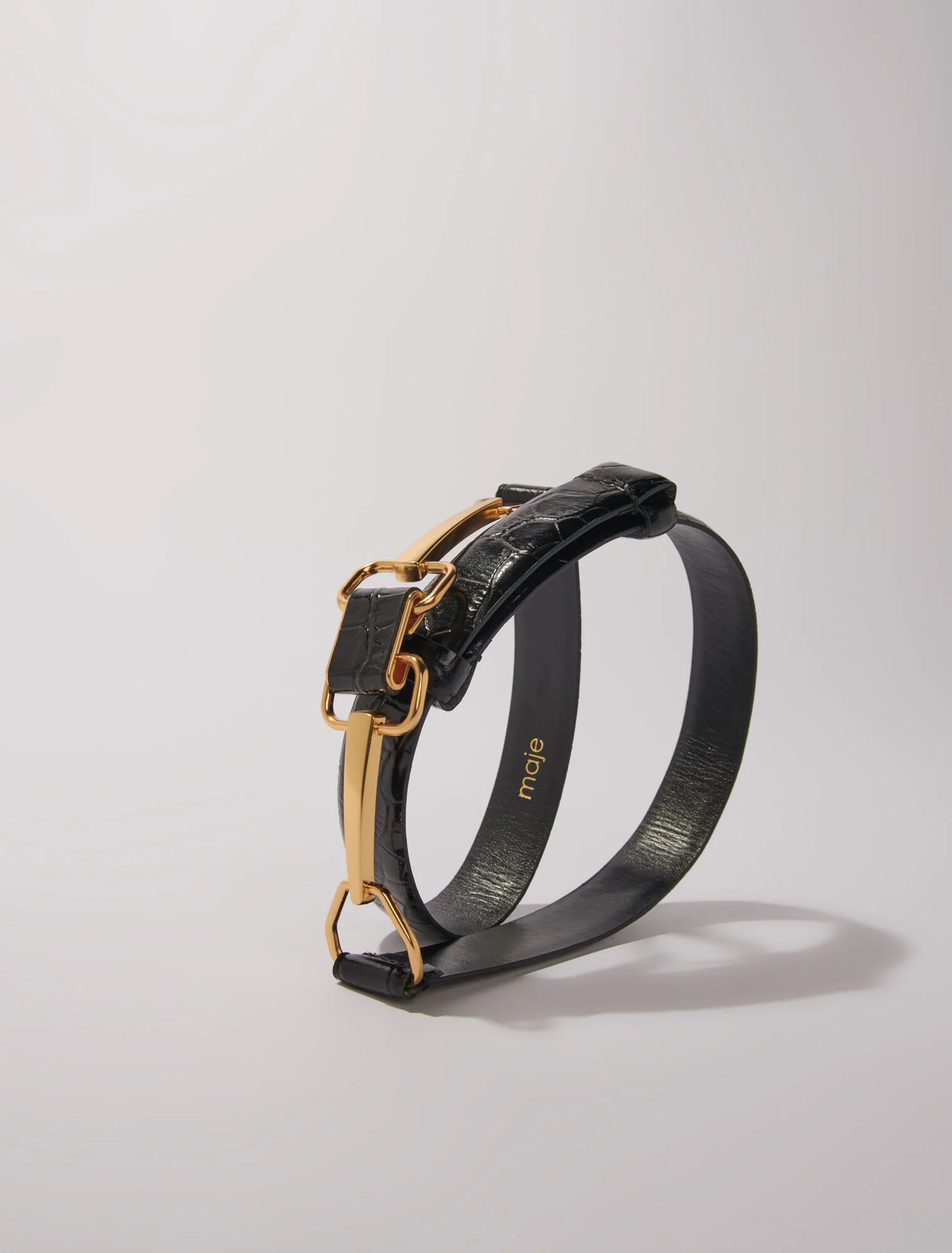 Leather belt with horse bit buckle