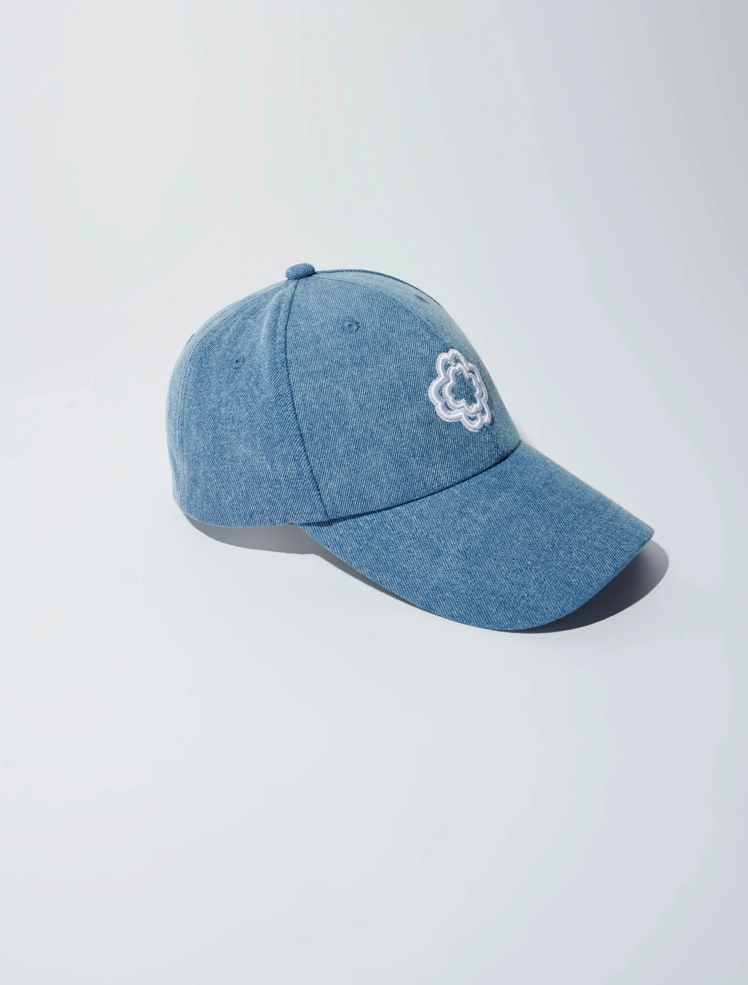 Denim cap with clover logo