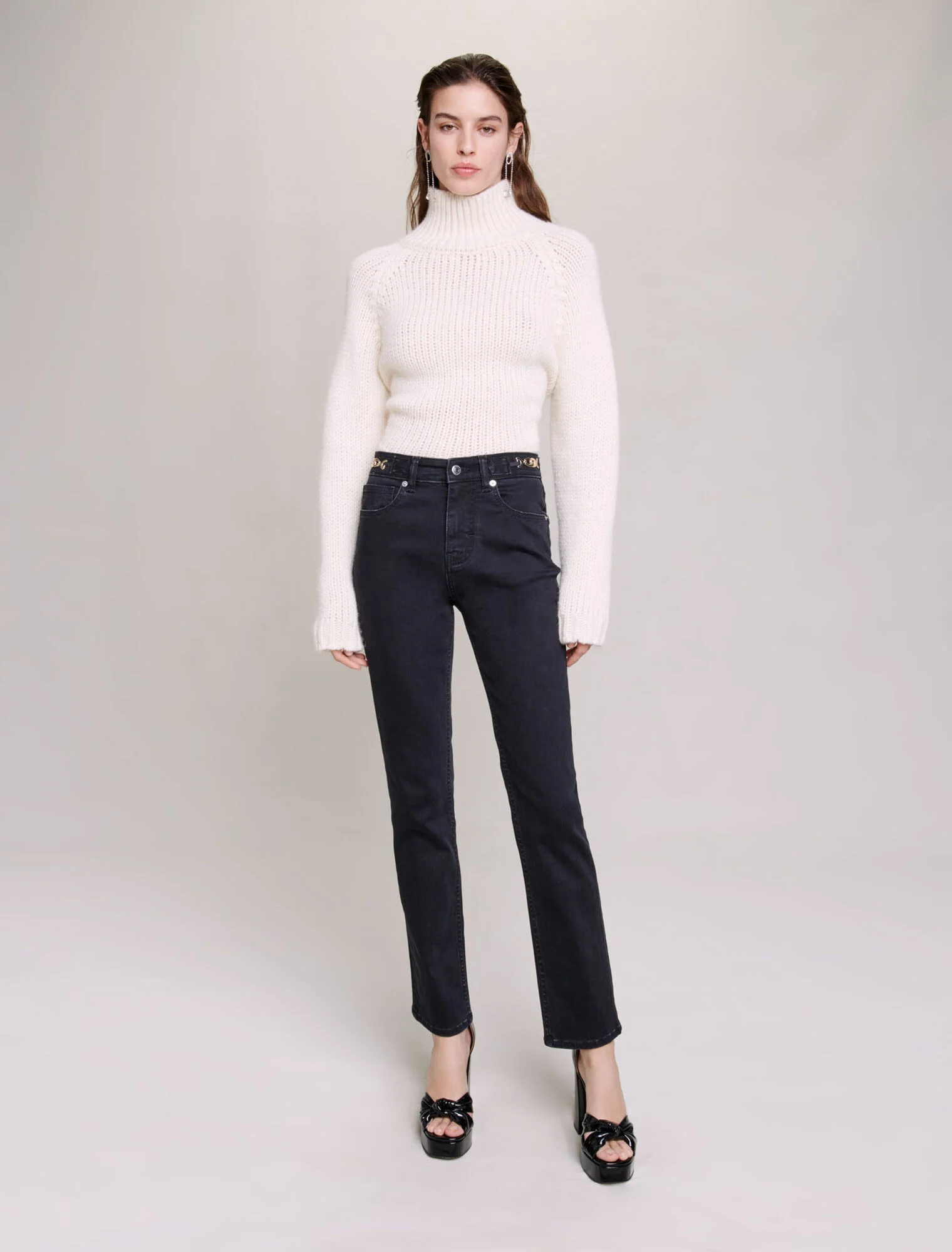 Jeans with curb chains and fringing