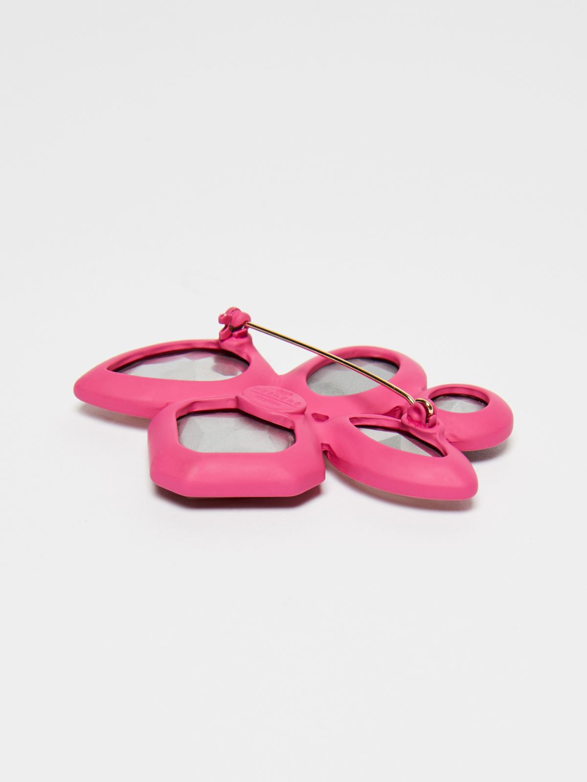 Metal and glass brooch