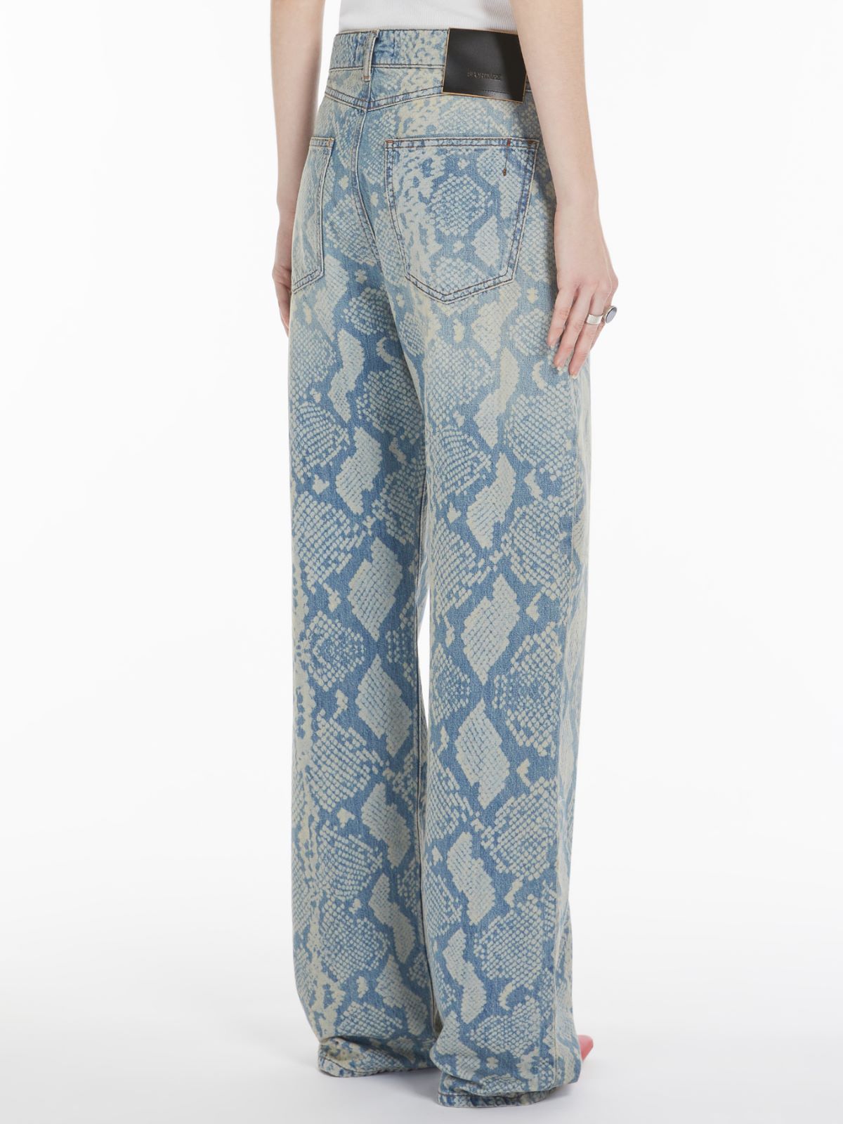 Five-pocket trousers with python print