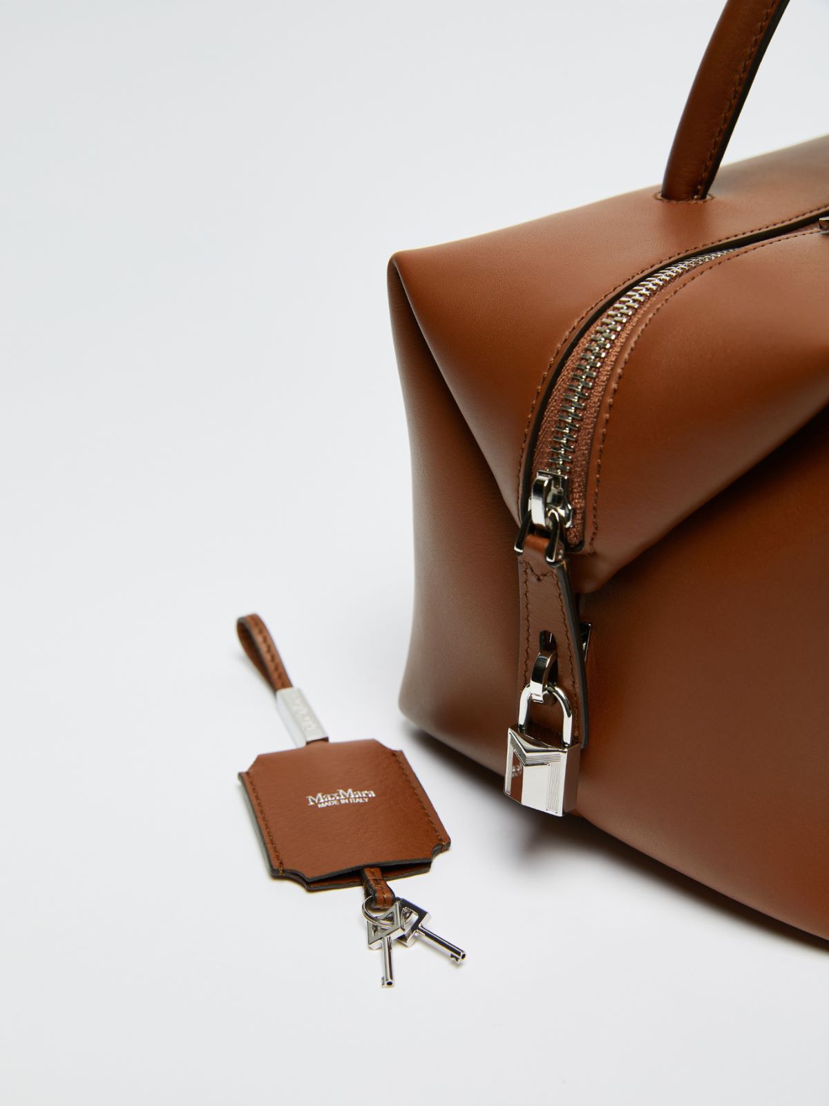 Shiny leather satchel bag