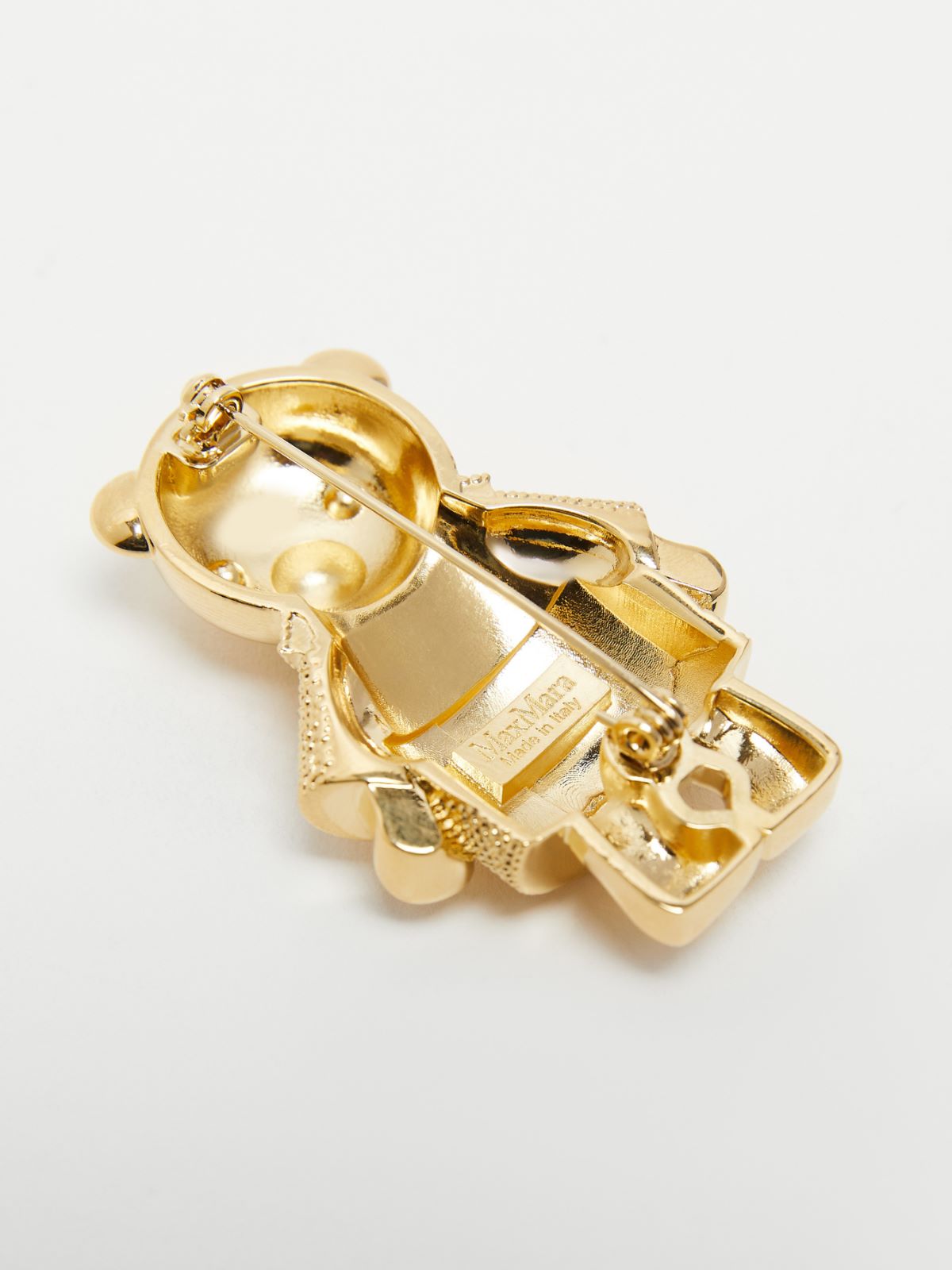 Metal teddy bear brooch