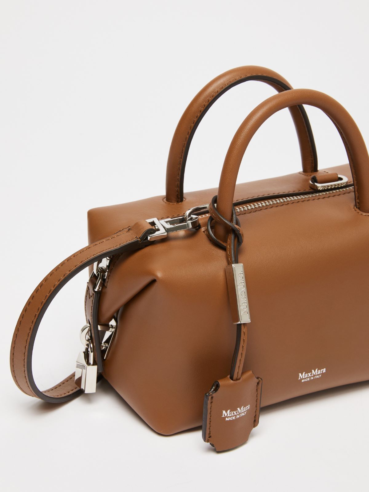 Small shiny leather satchel bag