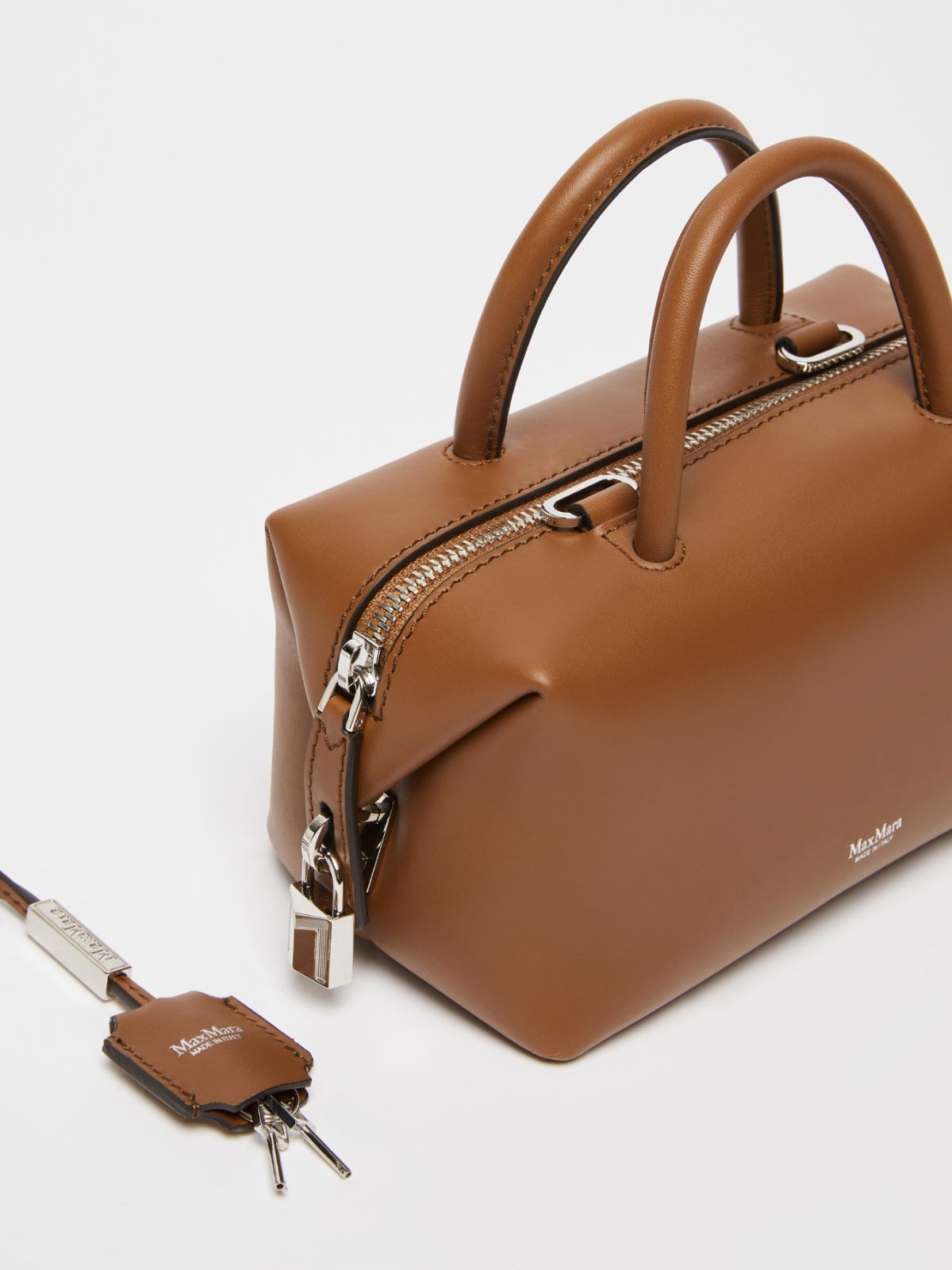 Small shiny leather satchel bag