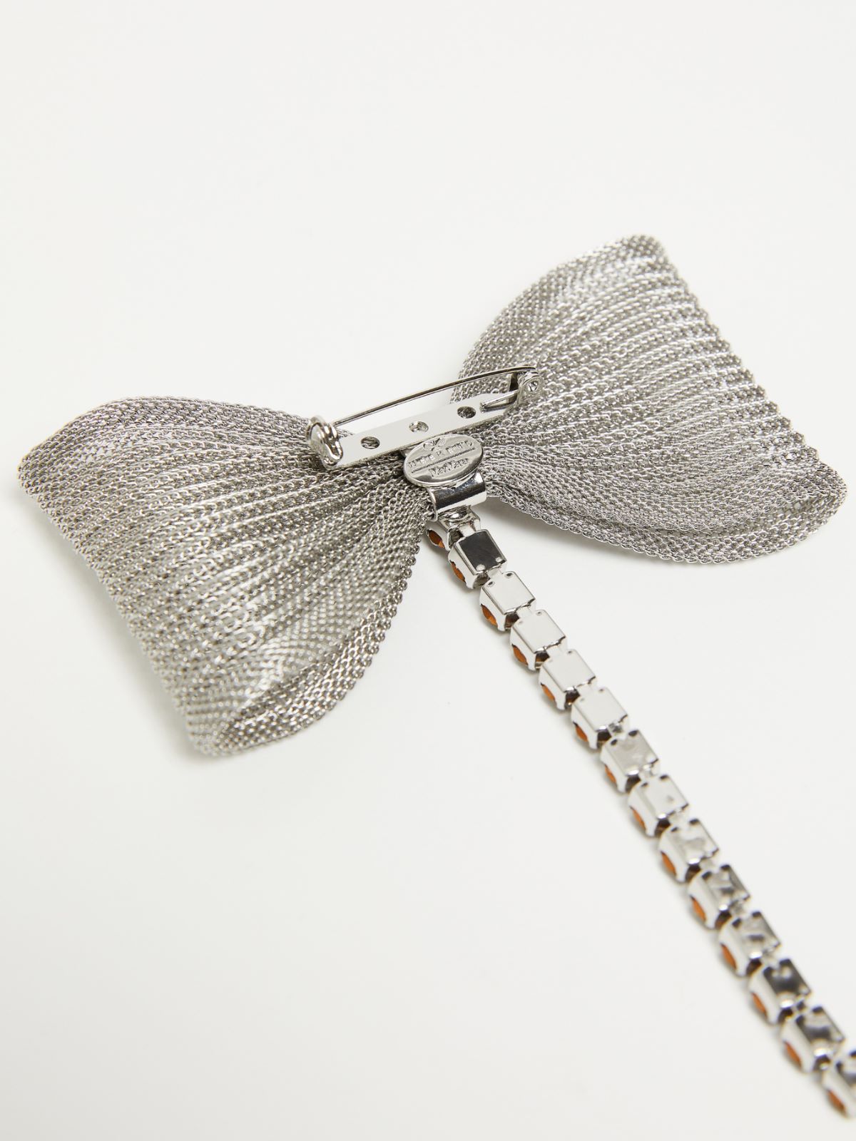 Metal and rhinestone brooch