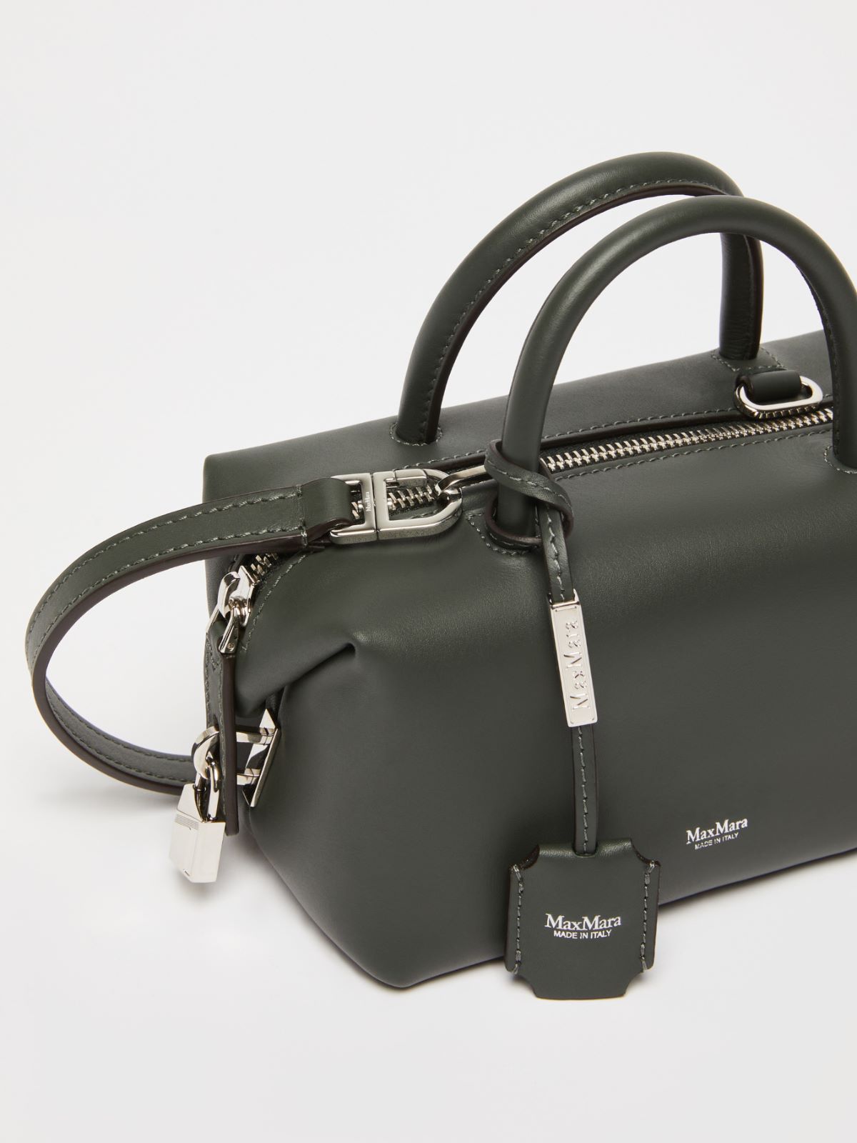 Small shiny leather satchel bag