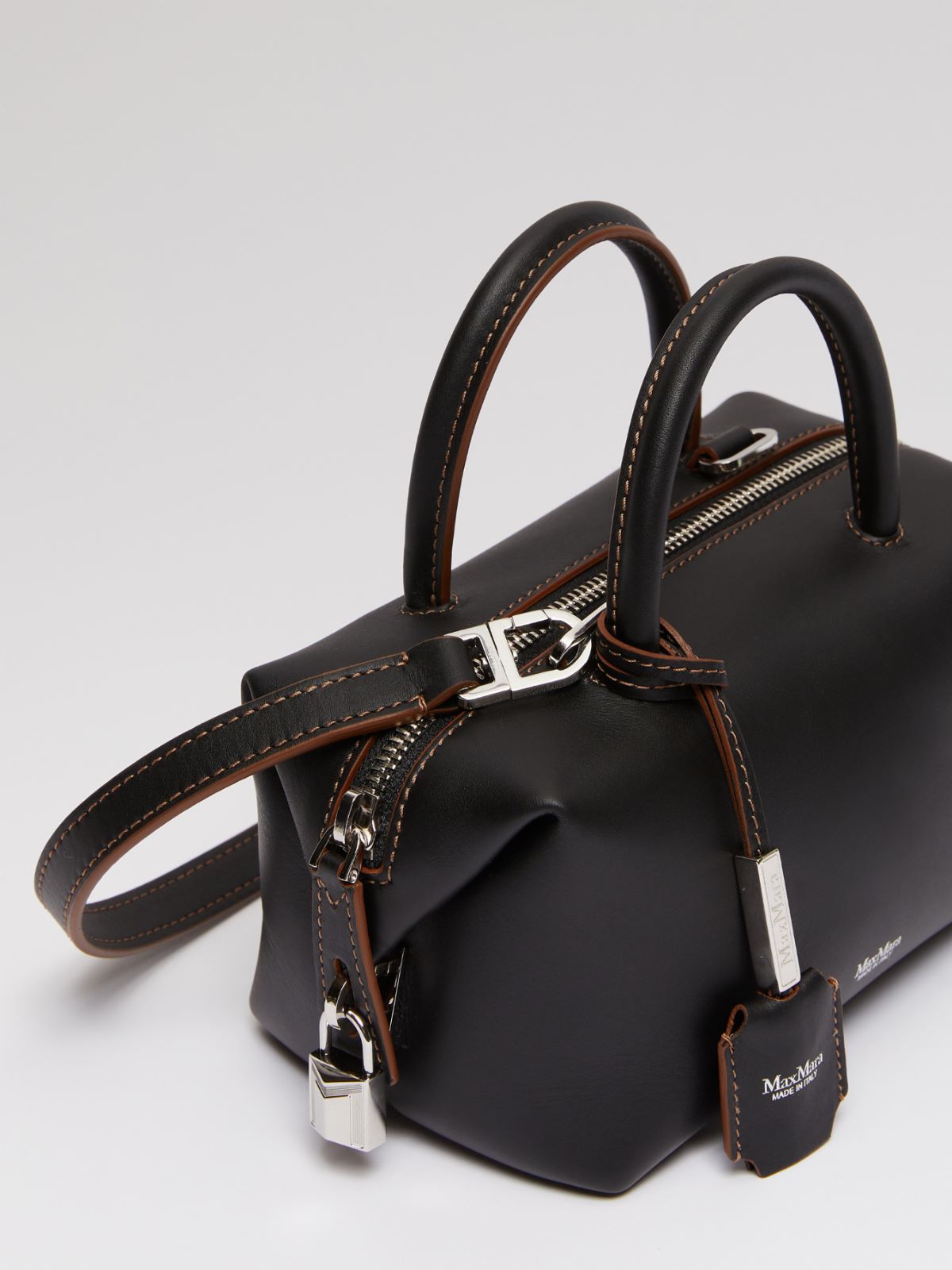 Small shiny leather satchel bag