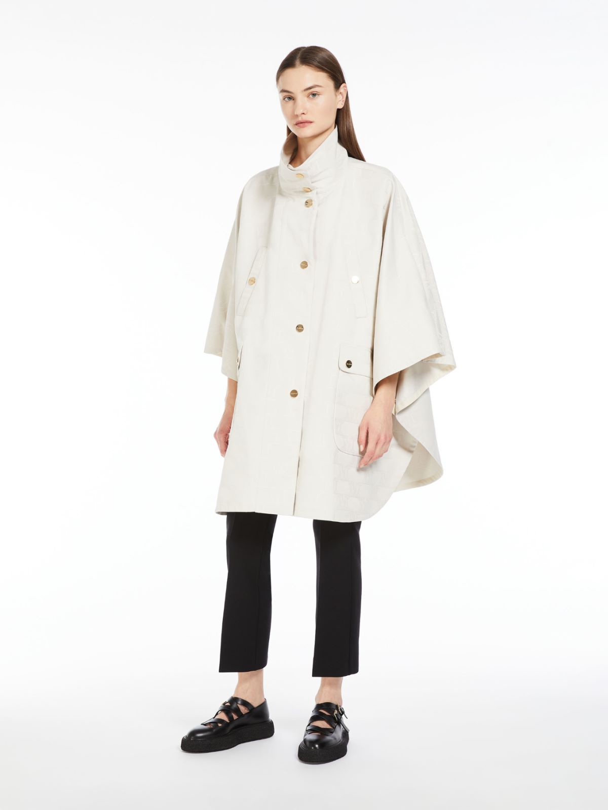 Short cape in water-resistant jacquard