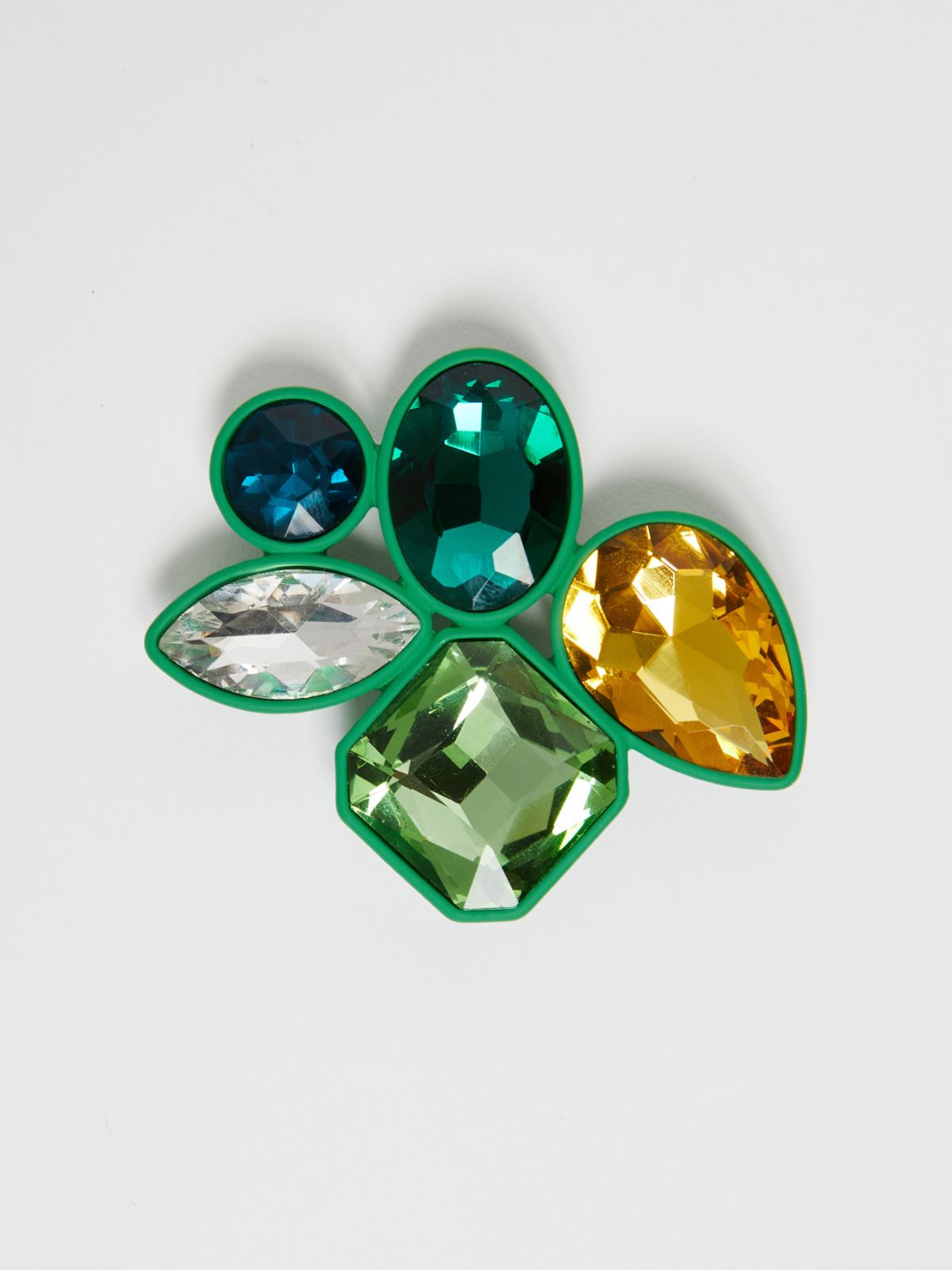 Metal and glass brooch