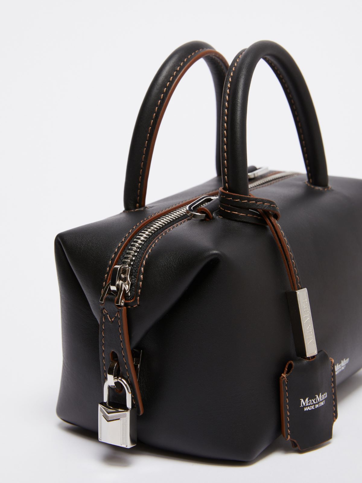 Small shiny leather satchel bag