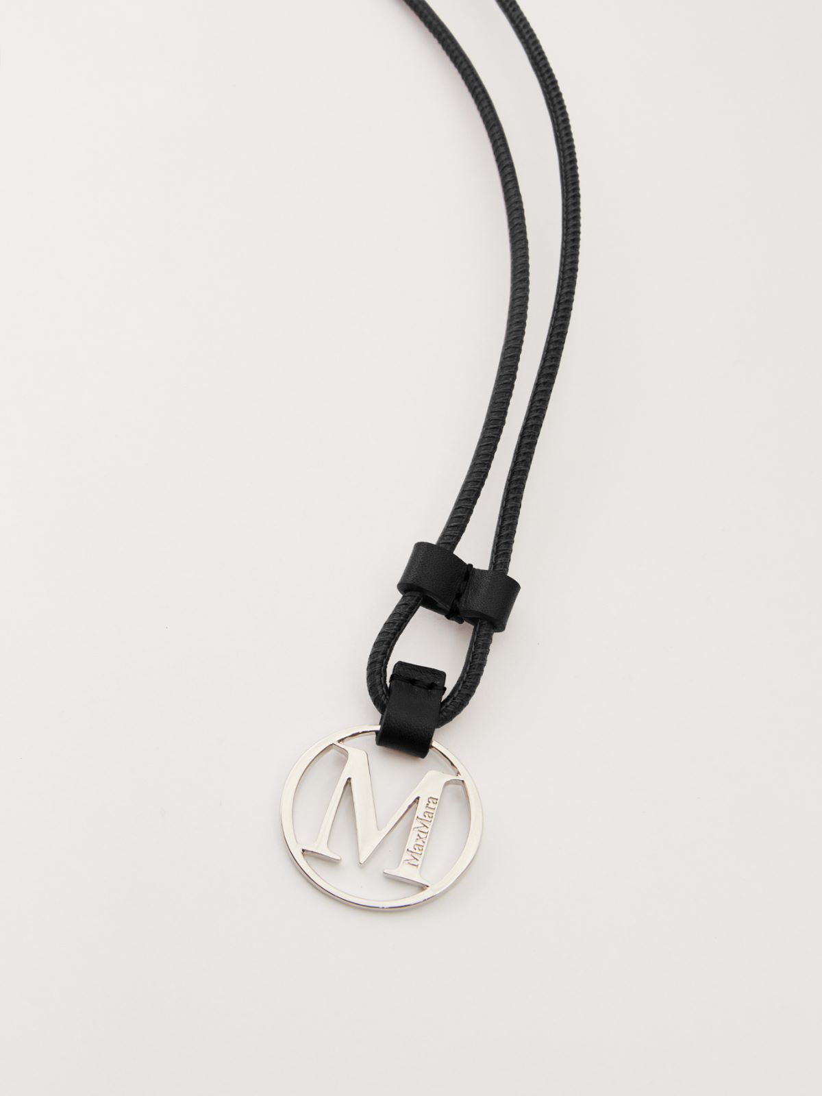 Monogram leather strap with pendant