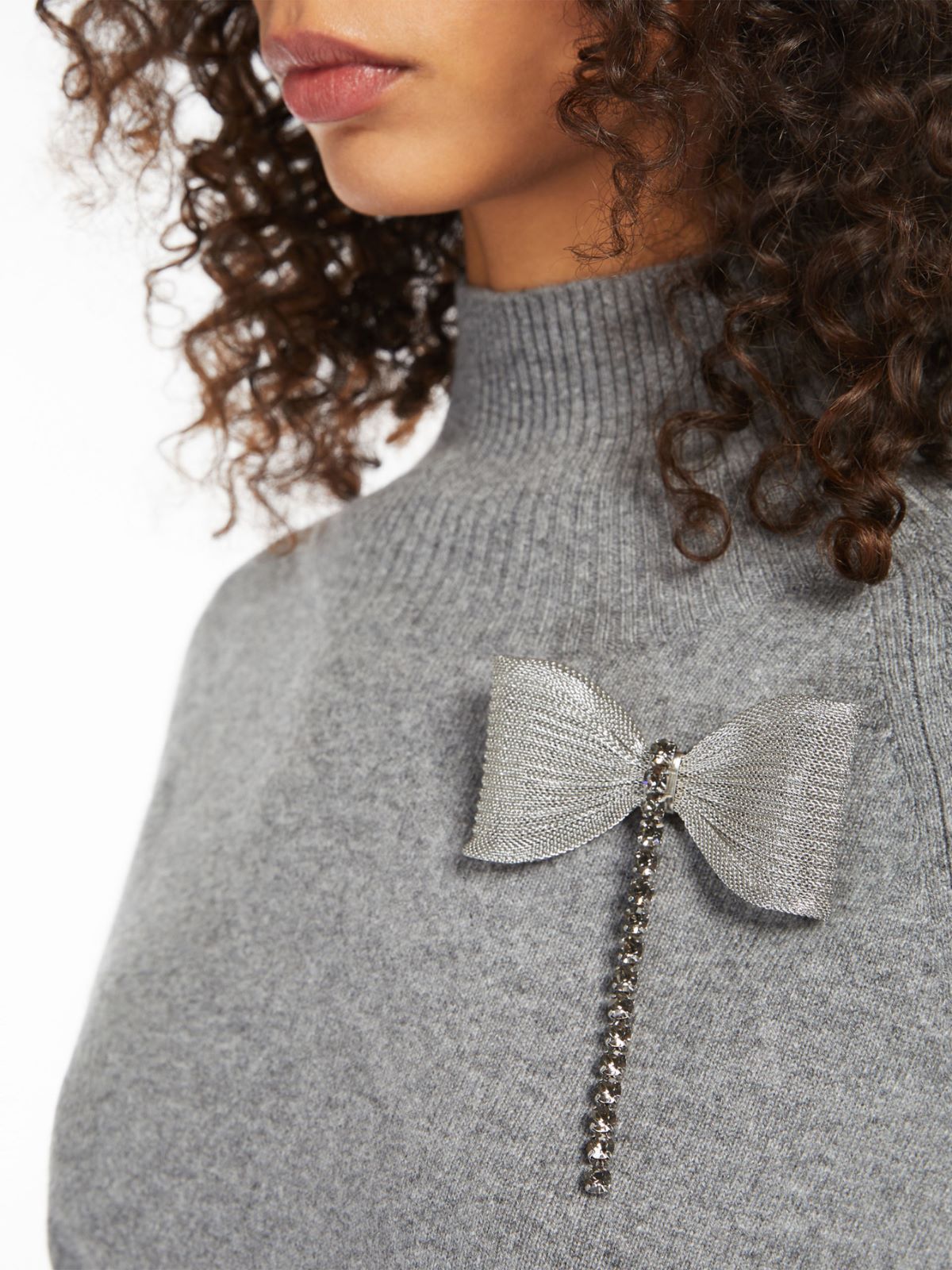 Metal and rhinestone brooch