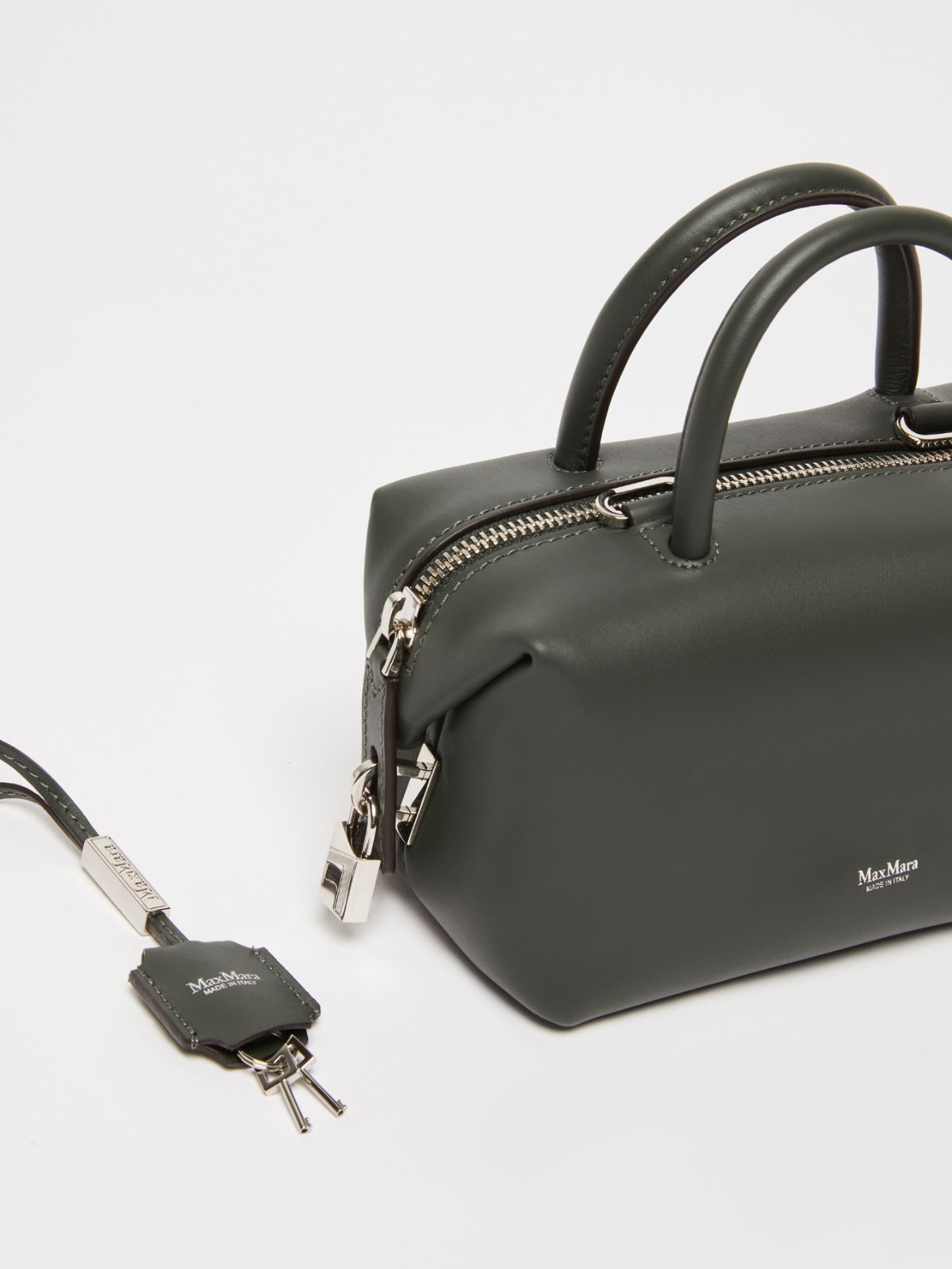 Small shiny leather satchel bag