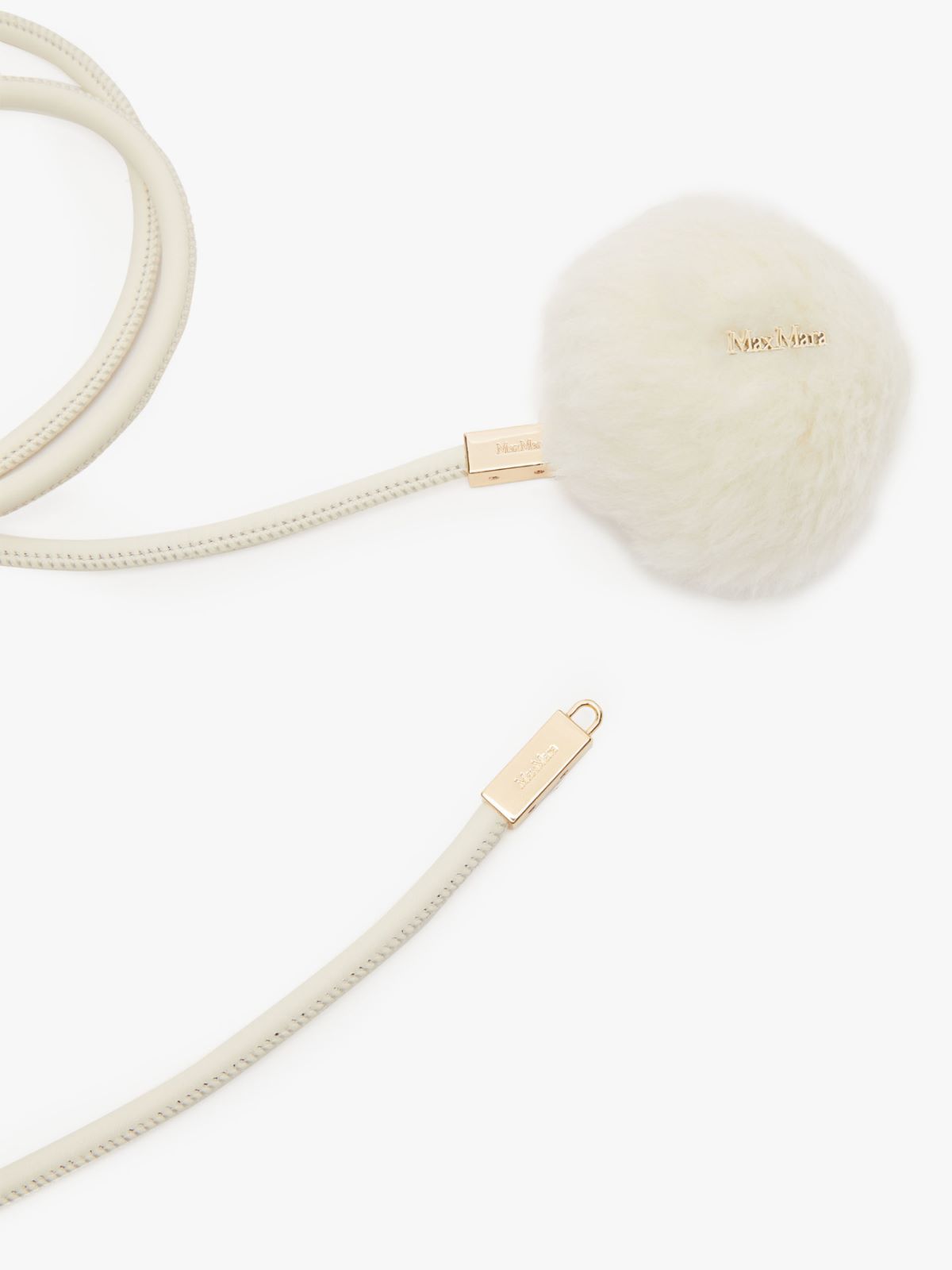 Tubular belt with pom-pom