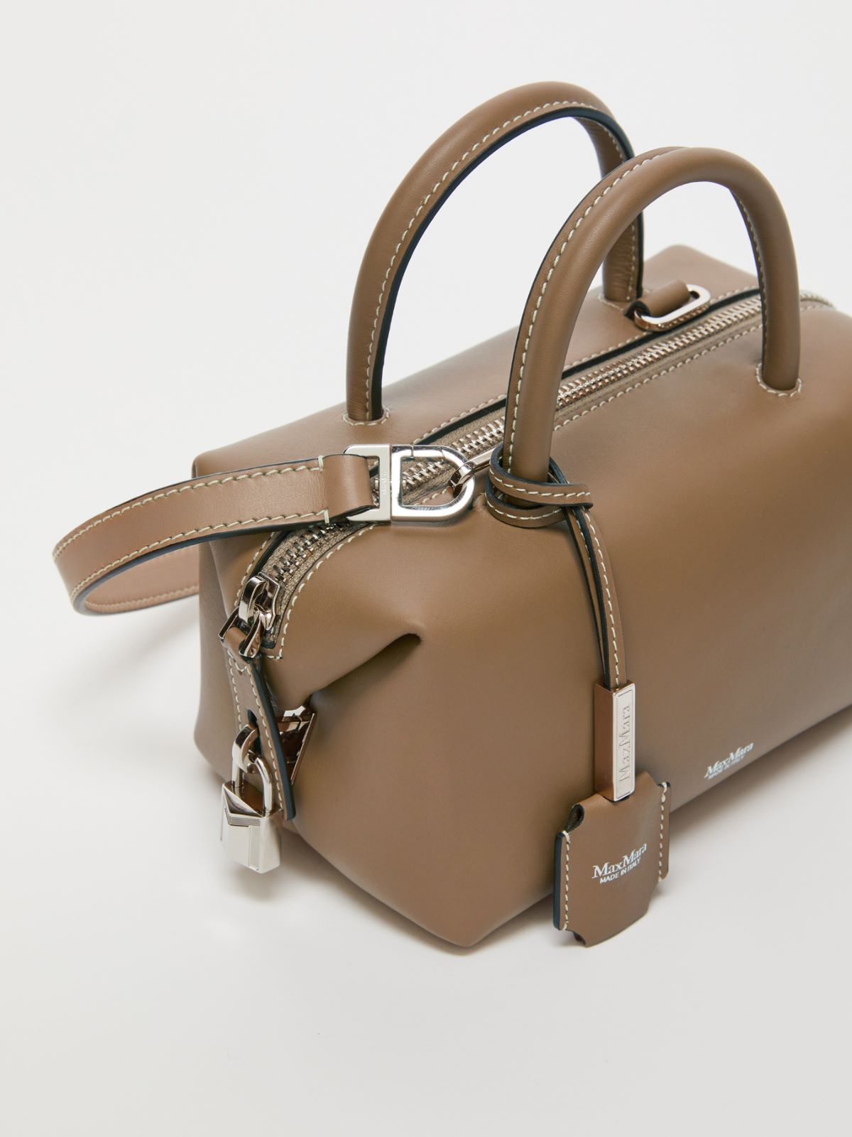 Small shiny leather satchel bag