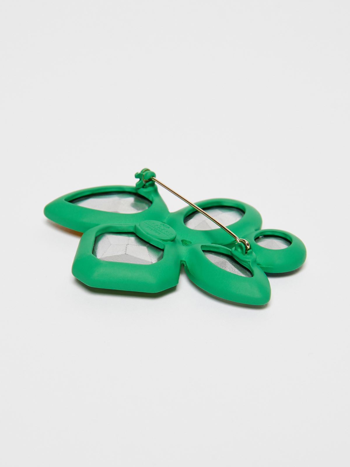 Metal and glass brooch