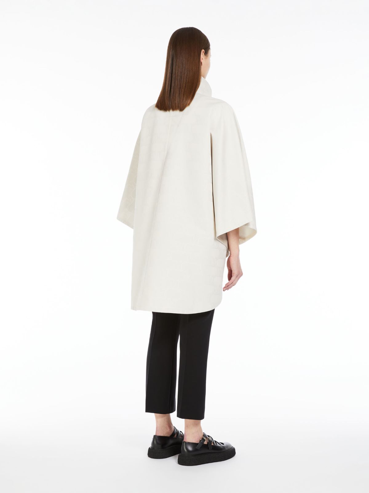 Short cape in water-resistant jacquard