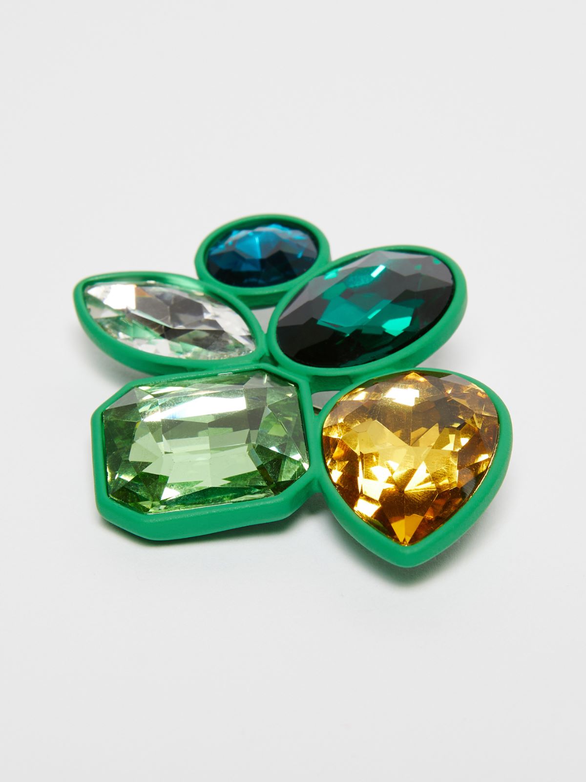 Metal and glass brooch